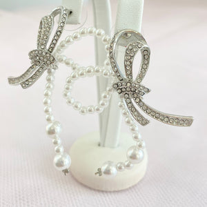 Silver Pearl And Rhinestone Bow's.