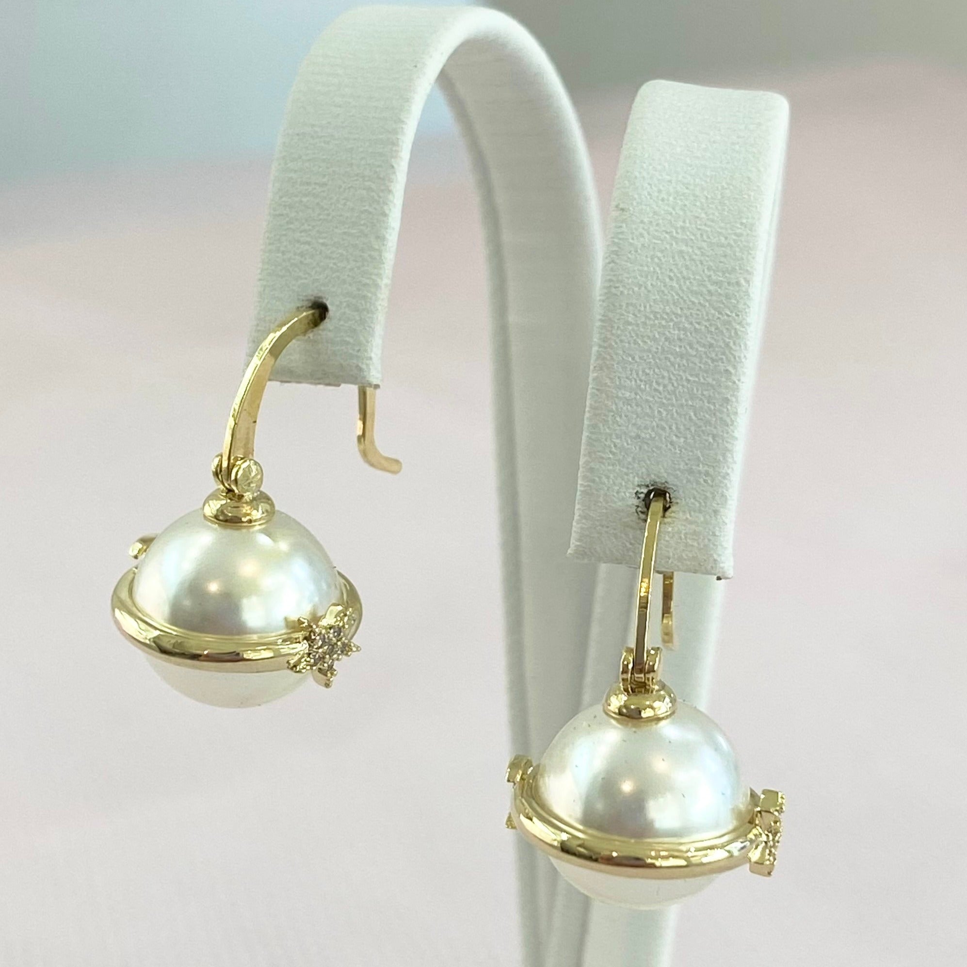 Gold Pearl Saturn Orb Earrings.